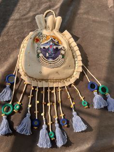 Handcrafted Traditional Potli Bag with Tassel Detailing - Image 2